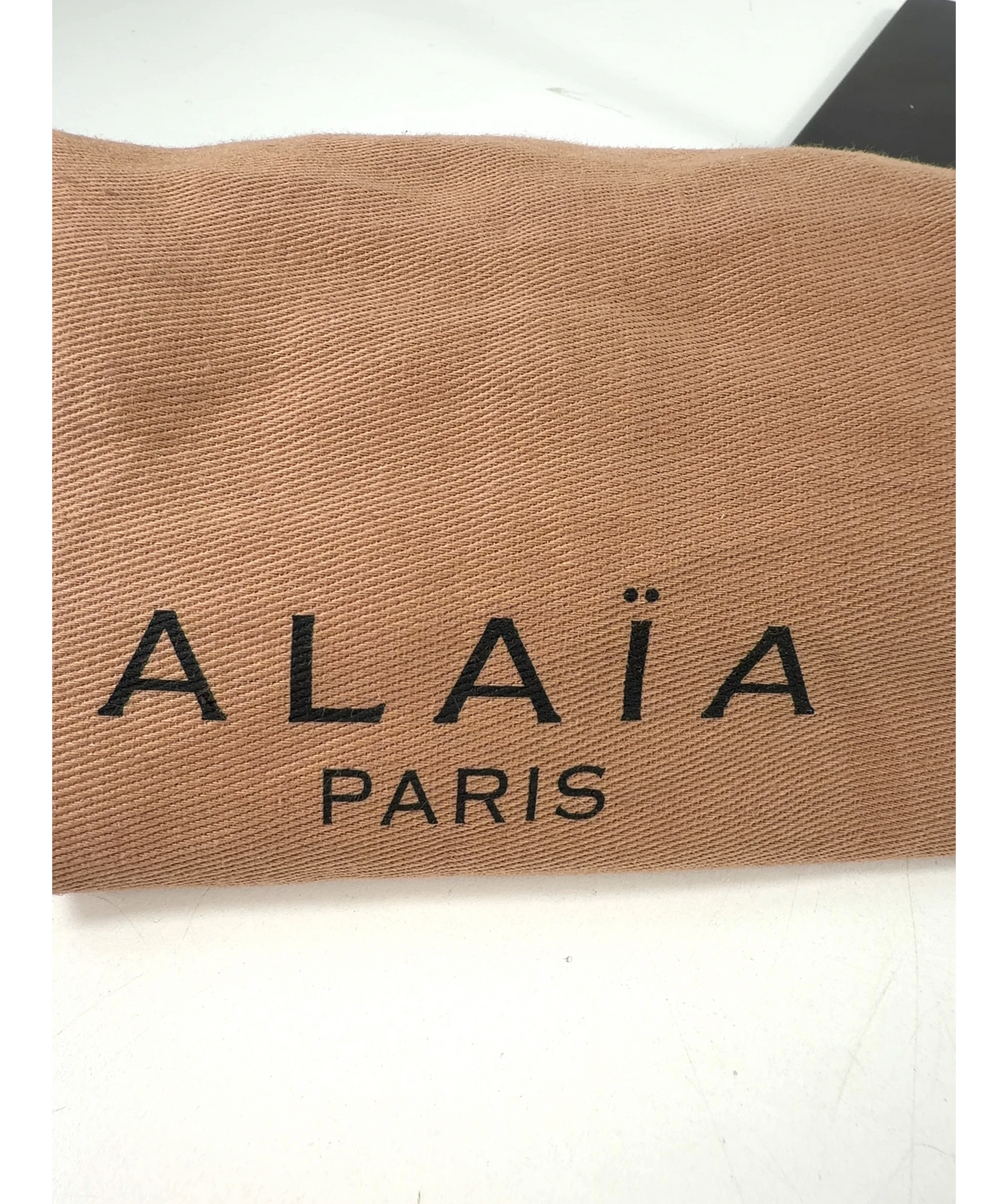 ALAIA White Colour — label