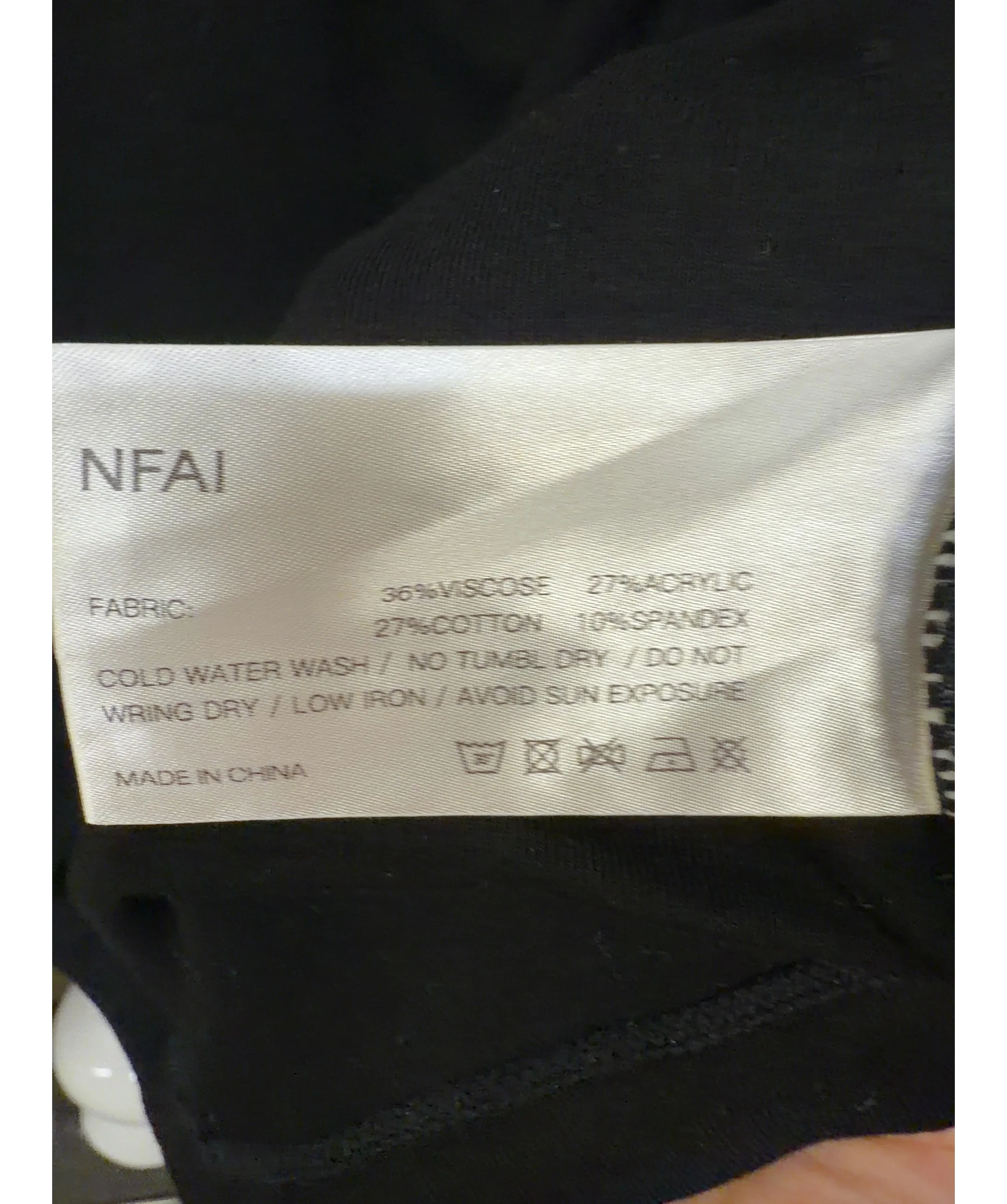 NFAI Black Push Tee — care label