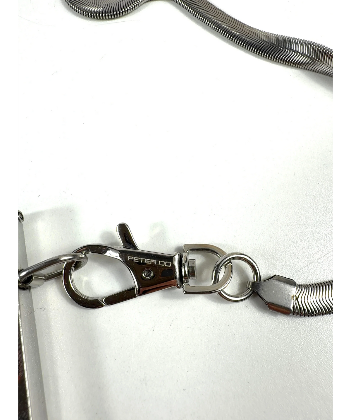 PETER DO silver metal hard-case lanyard/crossbody card case — detail