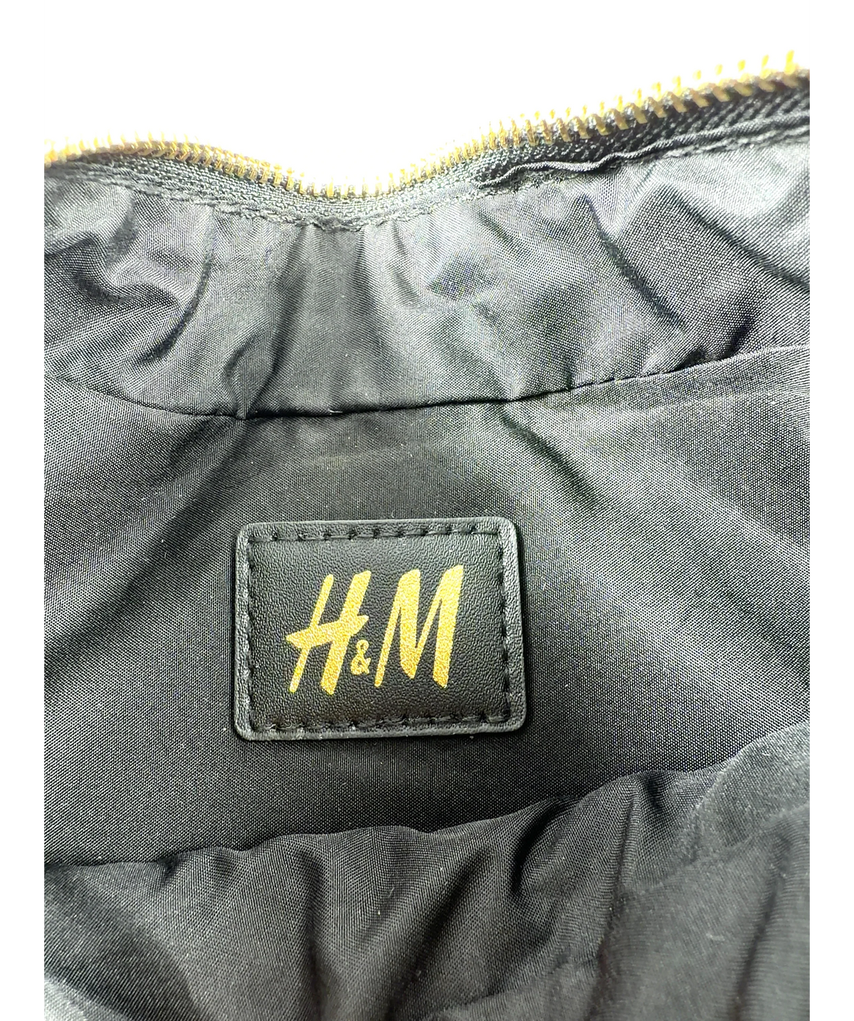 H&M Black zebra-print canvas shoulder bag — label