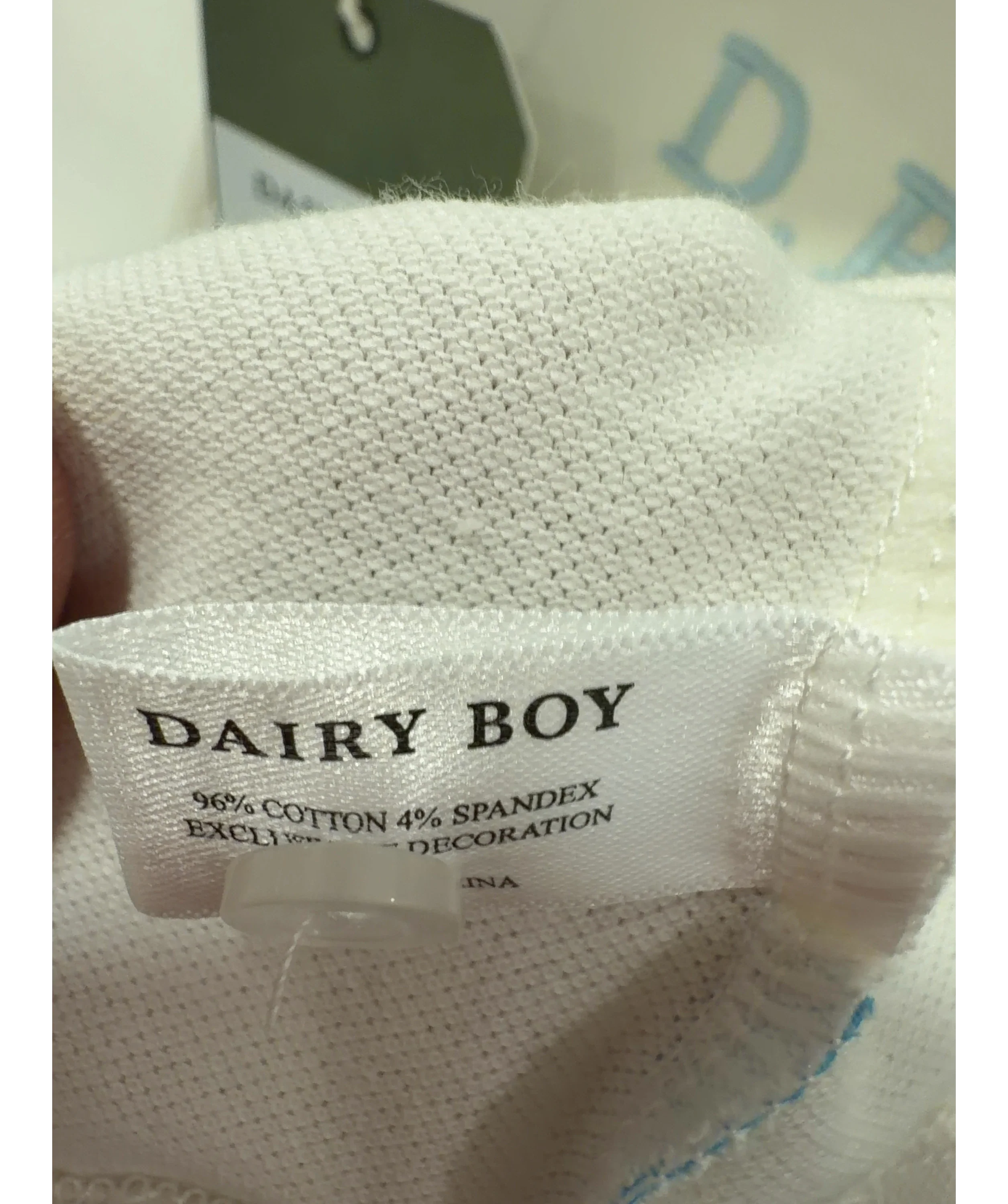 Dairy Boy White Baby Polo Soft White, size UK S — label
