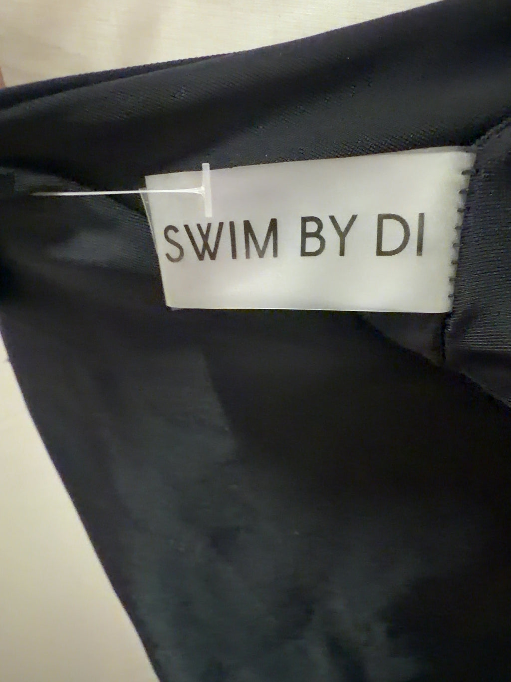 SWIM BY DI Black Black Pegeia Asymmetrical One-Piece Swimsuit, size UK S — care label