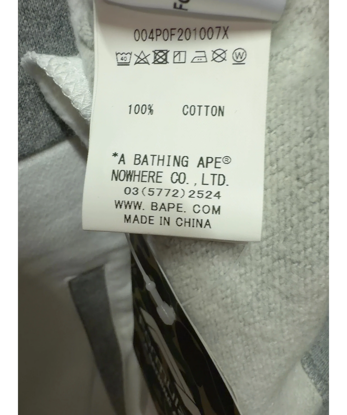 A Bathing Ape Grey BAPE x F1 1000 Two Tone Pullover Hoodie Black/Grey, size UK XXL — label