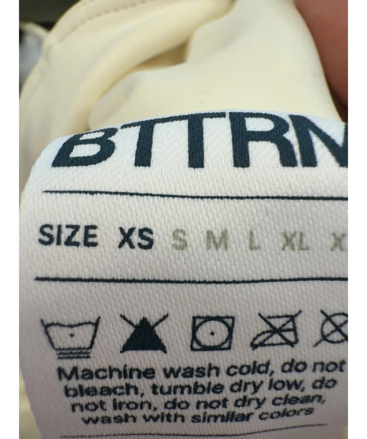BetterMe Cream activewear crop top, size UK XS — care label