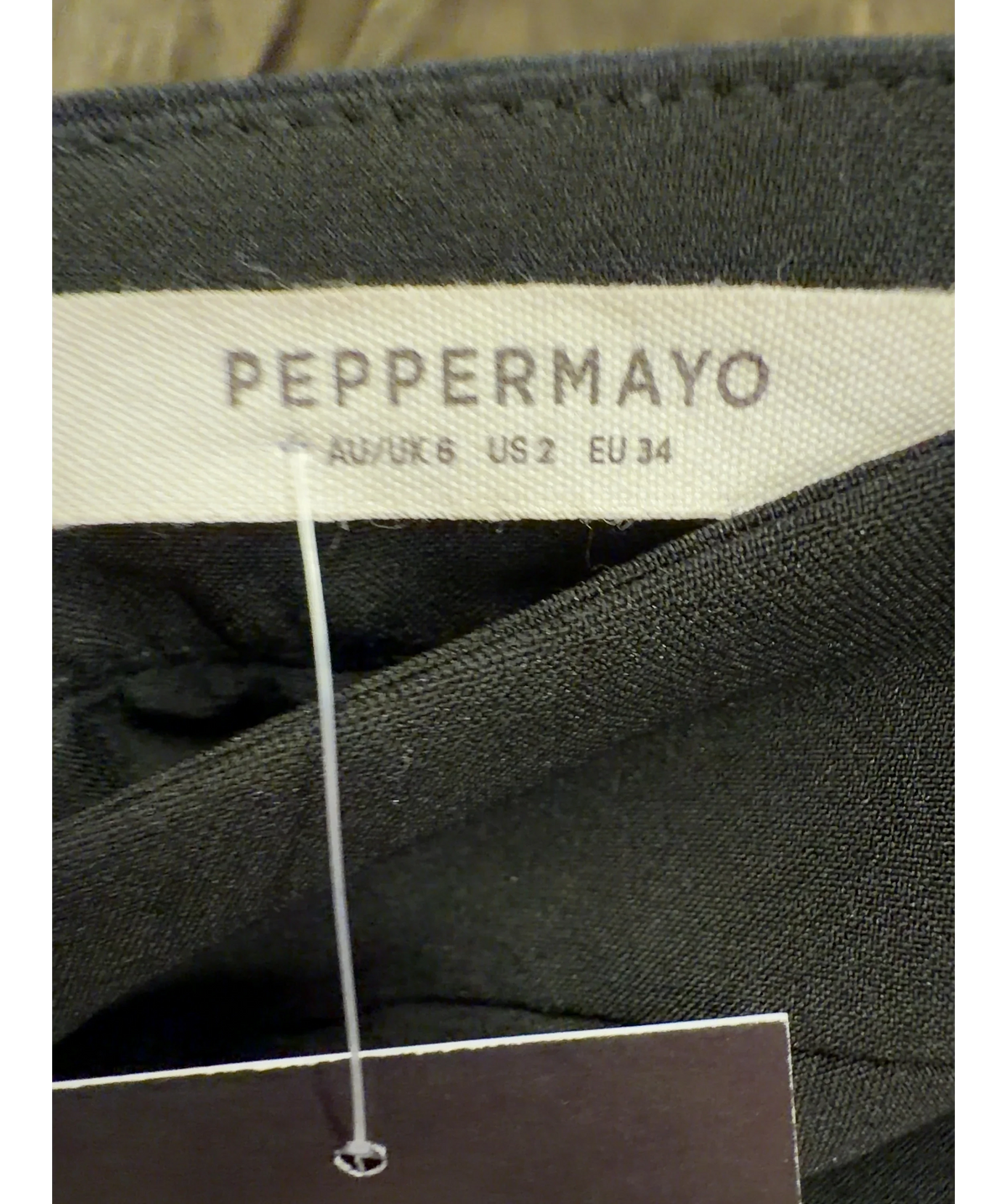Peppermayo Black strapless black mini dress with front split hem, size UK 6 — detail