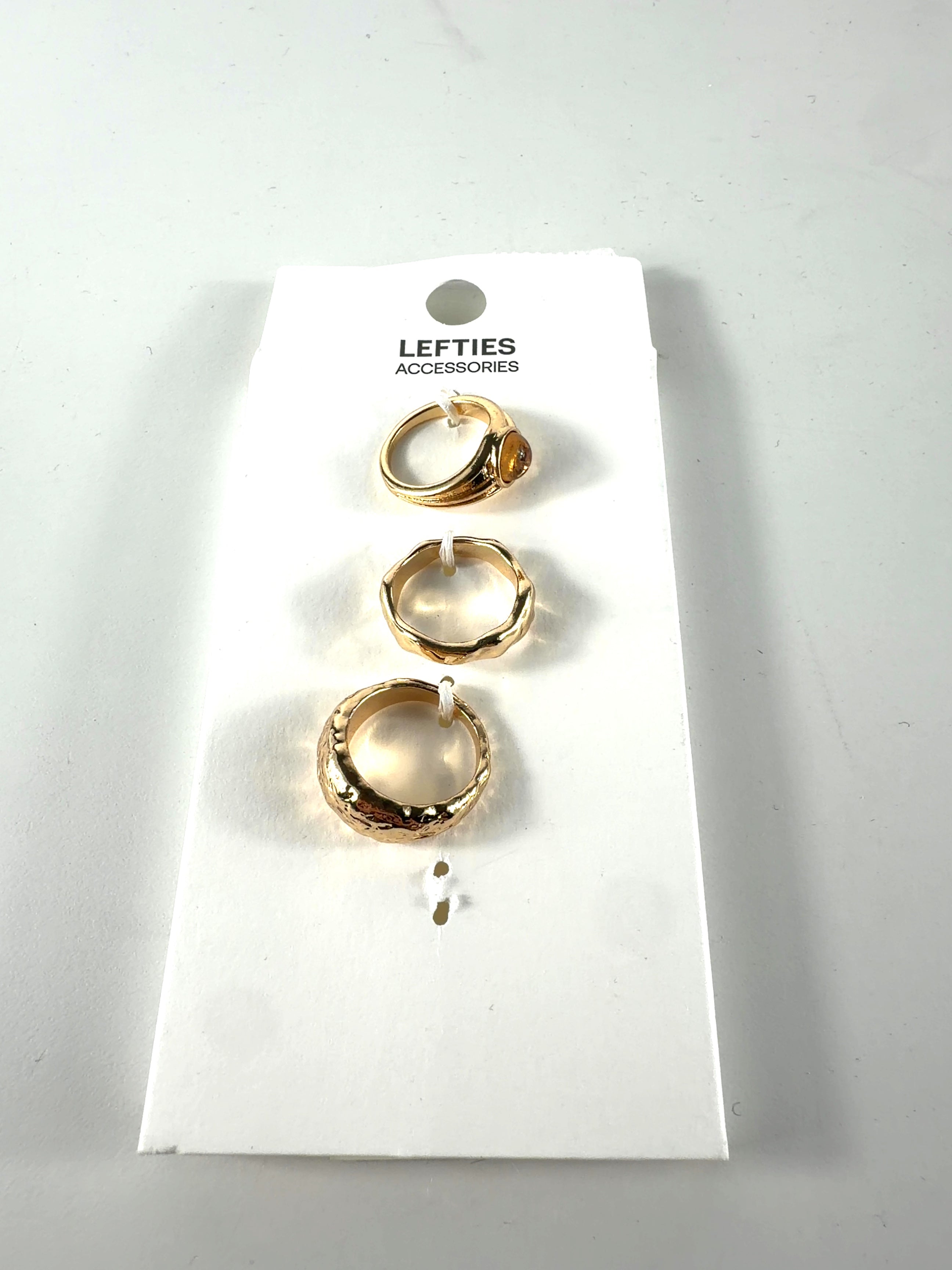Lefties Metallic 3-PIECE GOLD RING SET, size UK M — front
