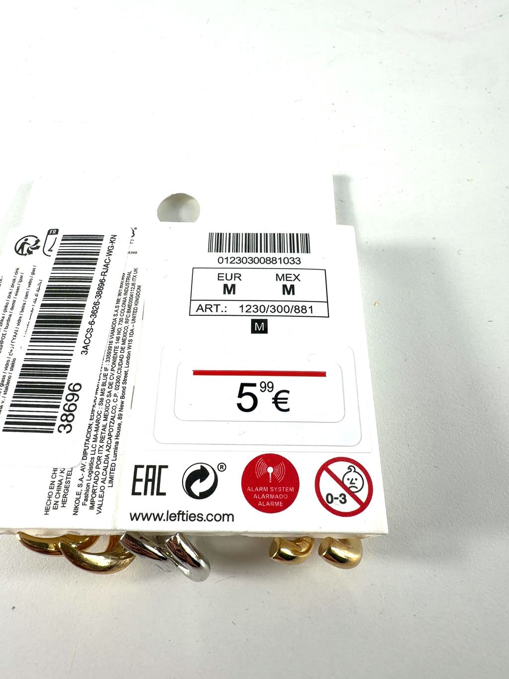 Lefties Metallic mismatched earring set — care label