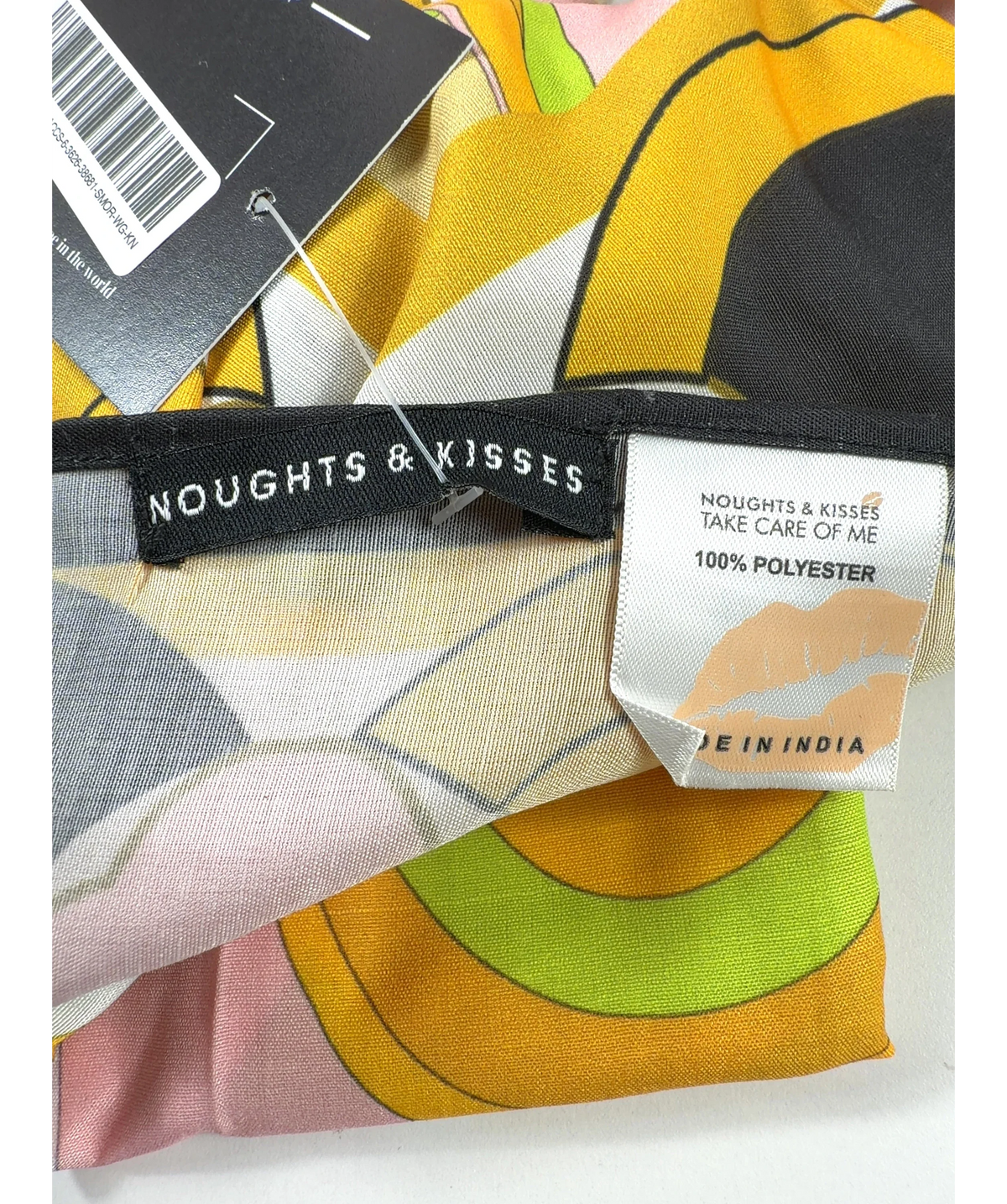 Noughts & Kisses Yellow Colour — care label
