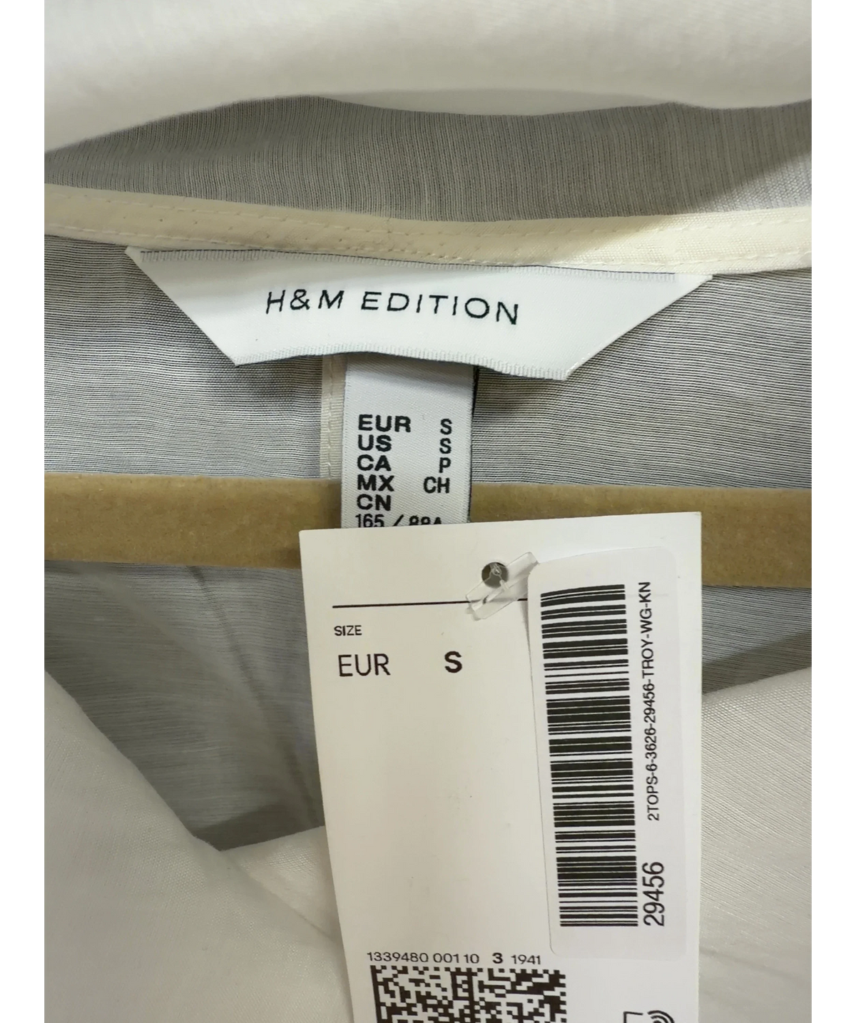 H&M White sheer lyocell-blend blouse, size UK S — care label