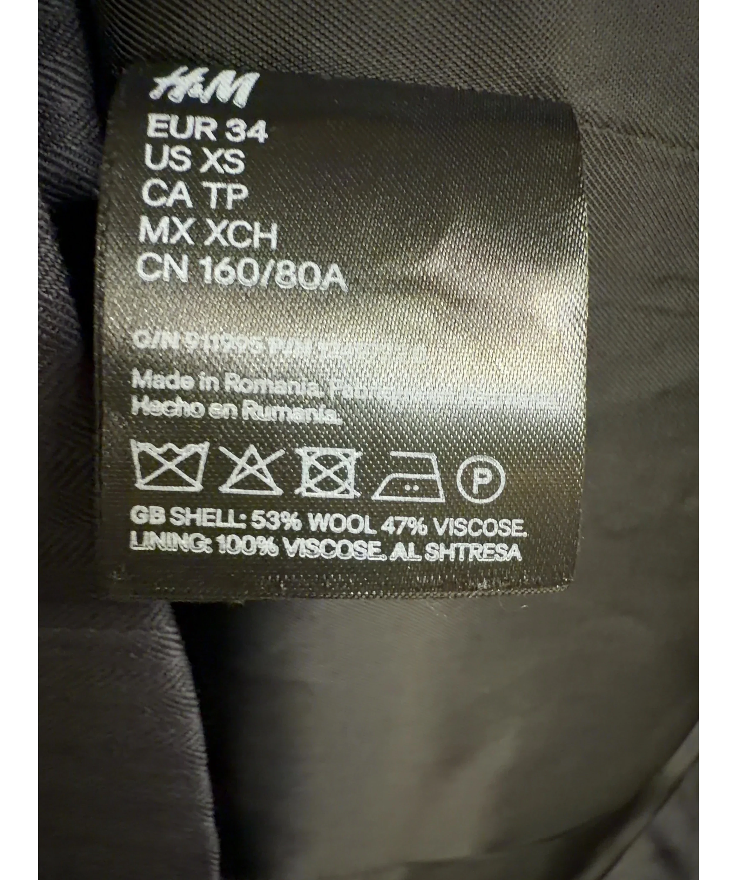 H&M Grey Studio grey pinstripe asymmetric wool-blend blazer, size UK 6 — label