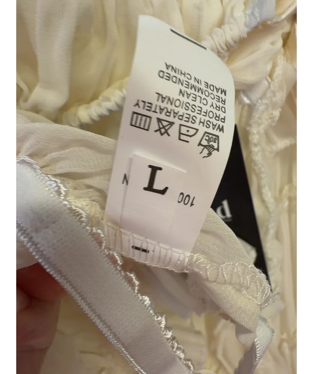Arcina Ori Cream Colour, size UK L — care label