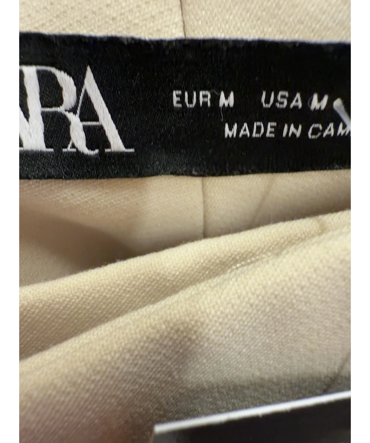 ZARA cream high-waisted pleated trousers, size UK M — care label