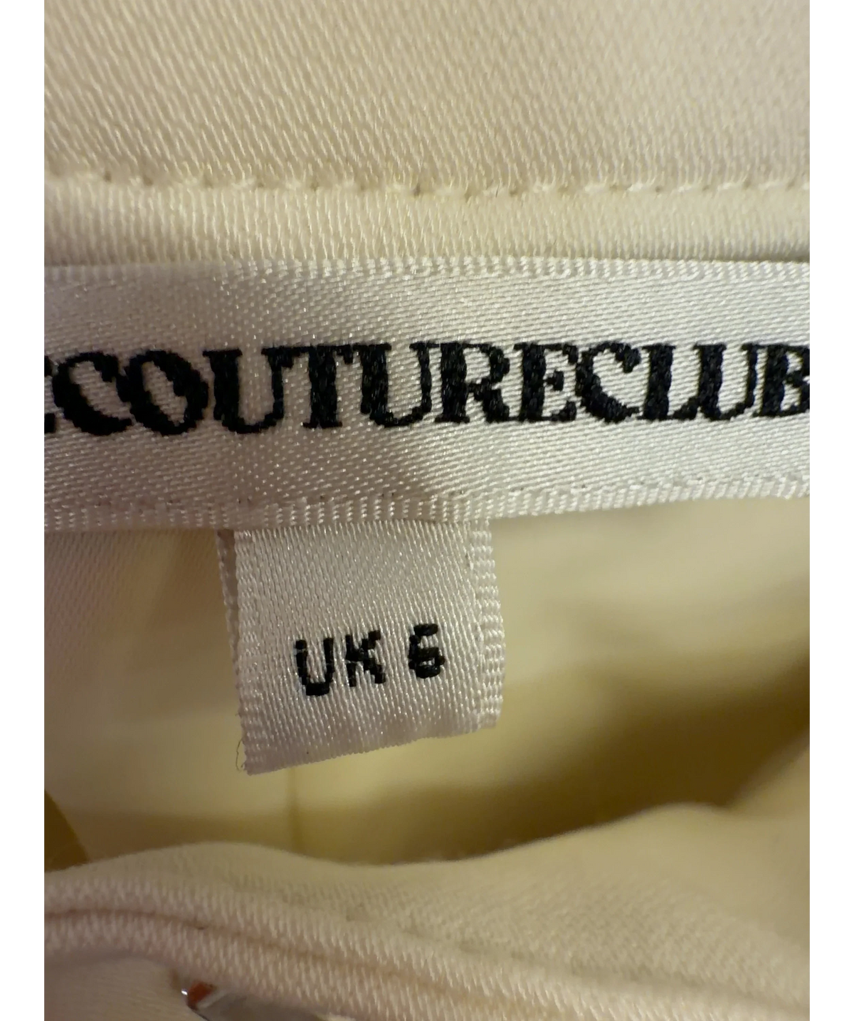 The Couture Club Cream pleated trousers, size UK 6 — care label