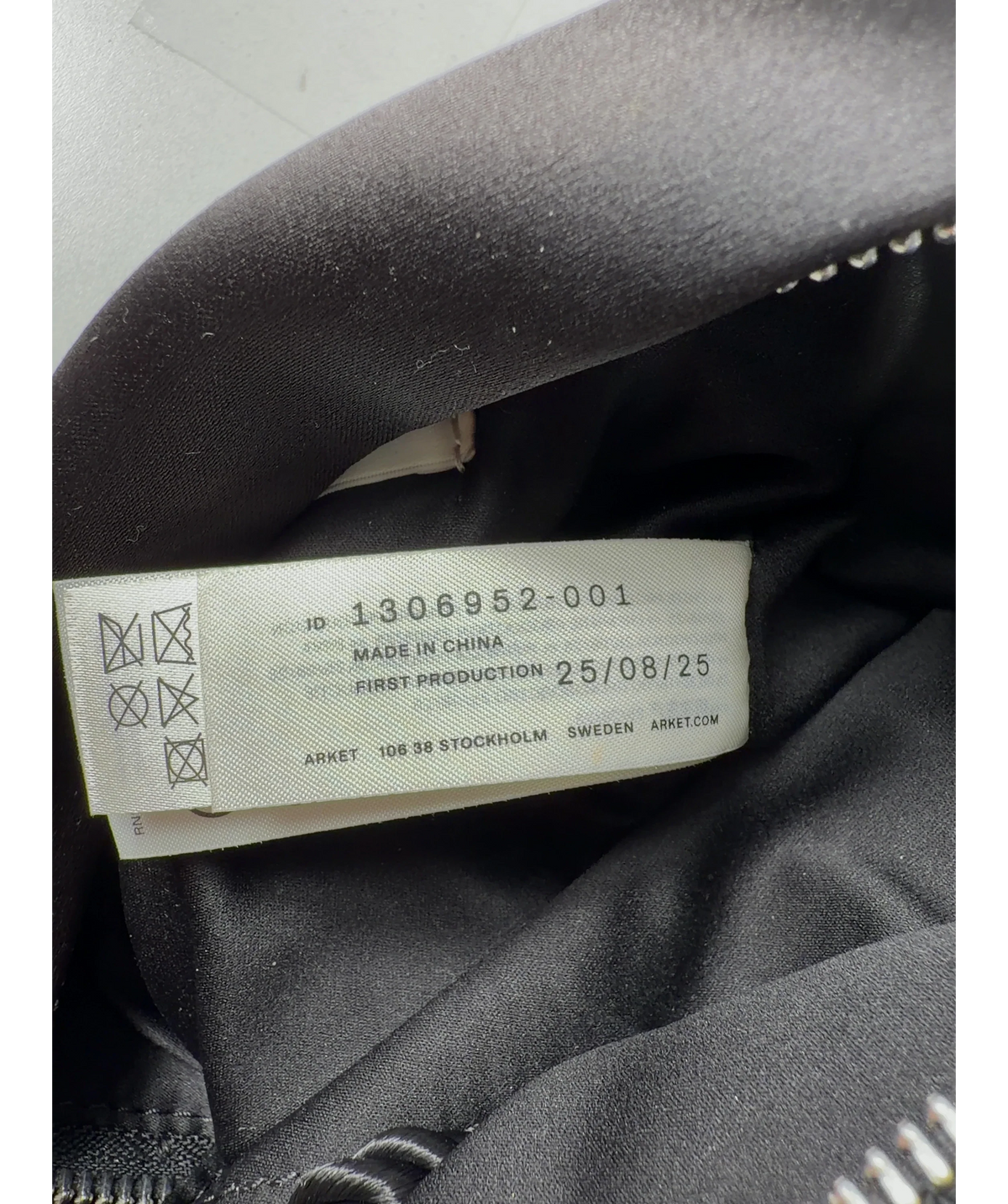 ARKET Black Tassel Bag — care label