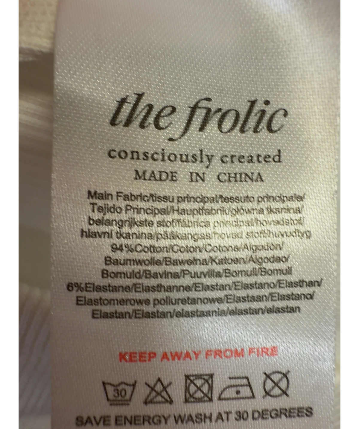The Frolic White exclusive cotton rich bead flower front vest top, size UK 8 — label