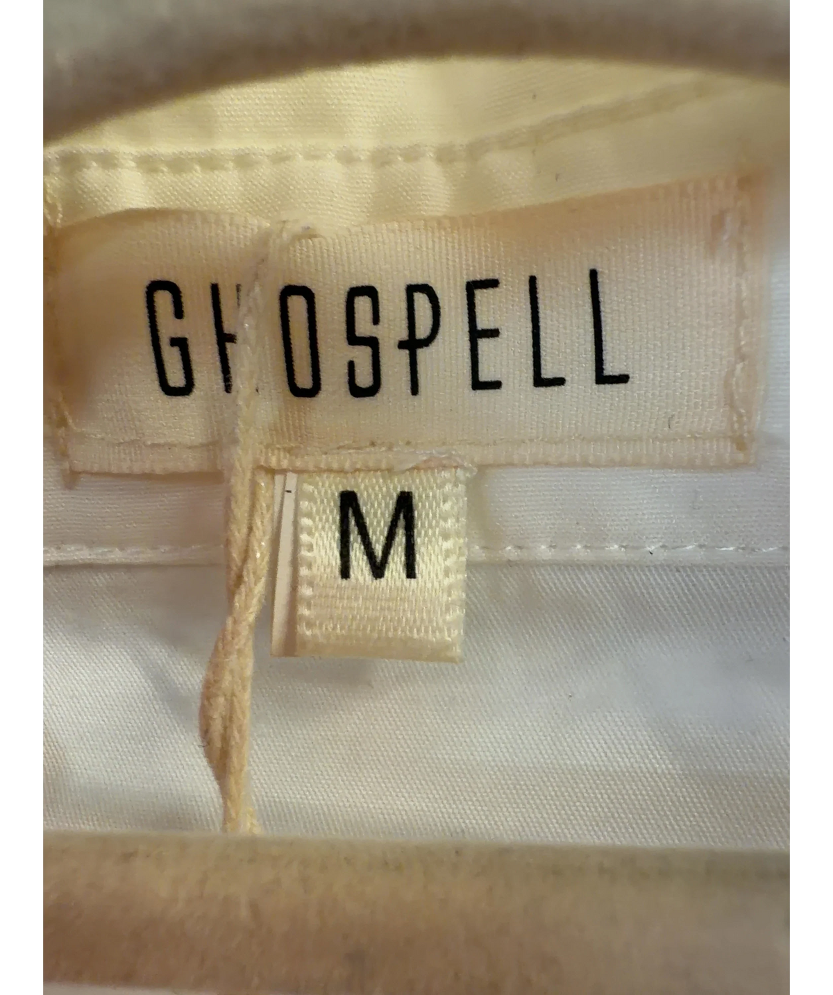 Ghospell White relaxed-fit white shirt with metal eyelets and rings along the collar, size UK M — care label