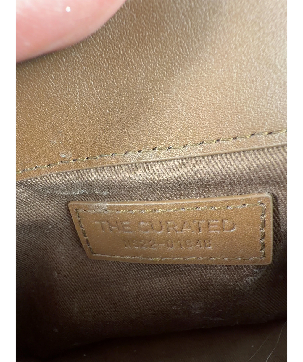 The Curated Brown Colour — label