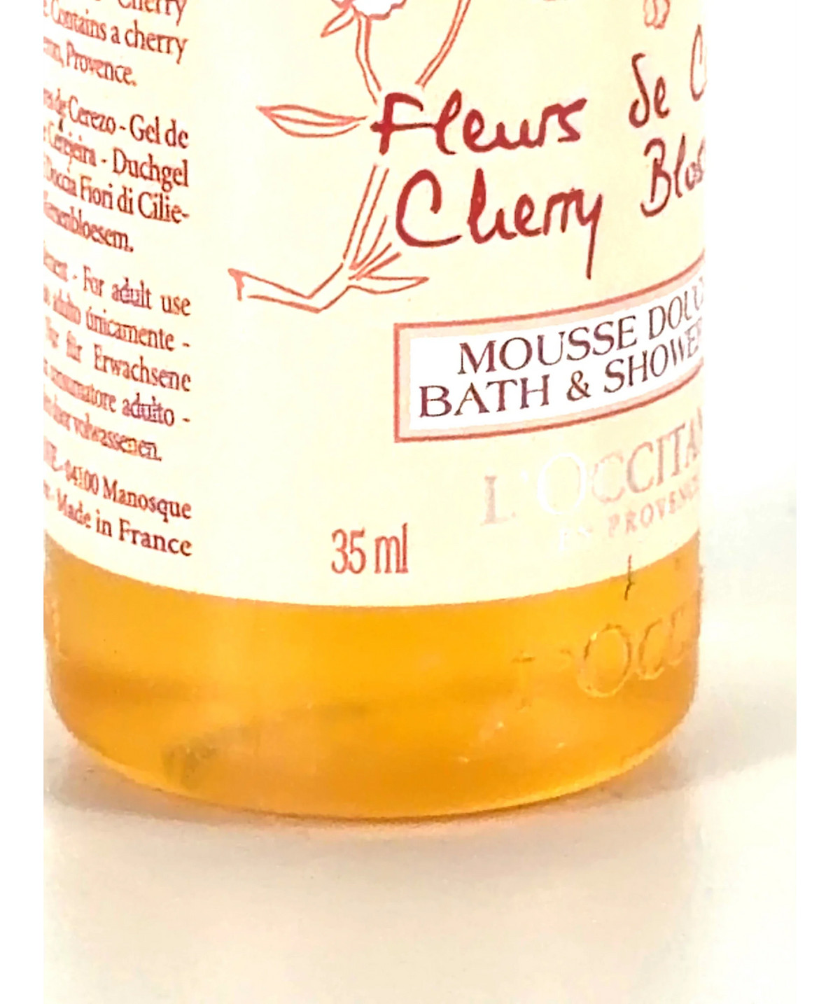Loccitane Fleurs see creosote cherry blossom bath and shower gel, size 35ml — care label