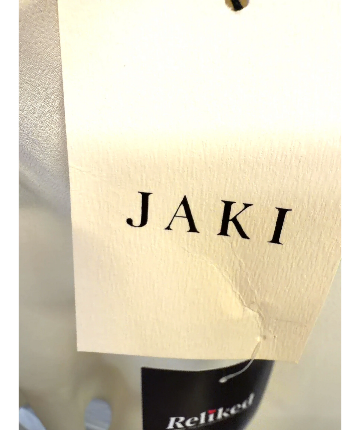 JAKI LONDON Cream asymmetric draped top, size UK XL — detail