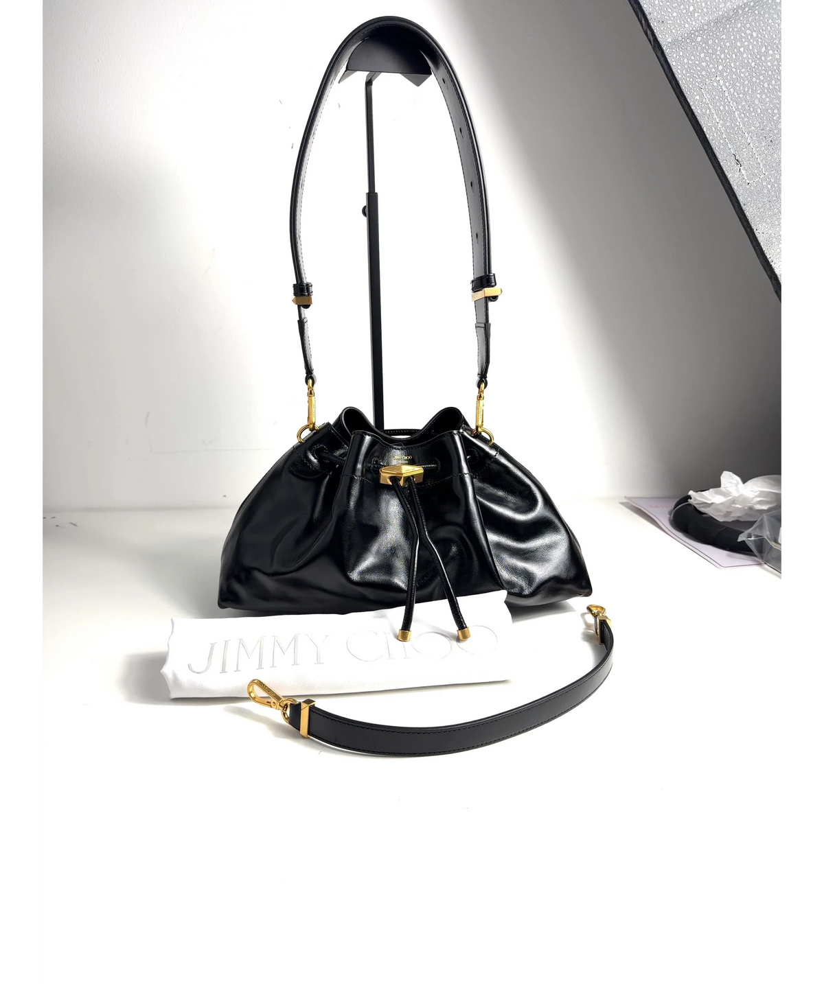 Jimmy Choo Black Cinch Small — care label
