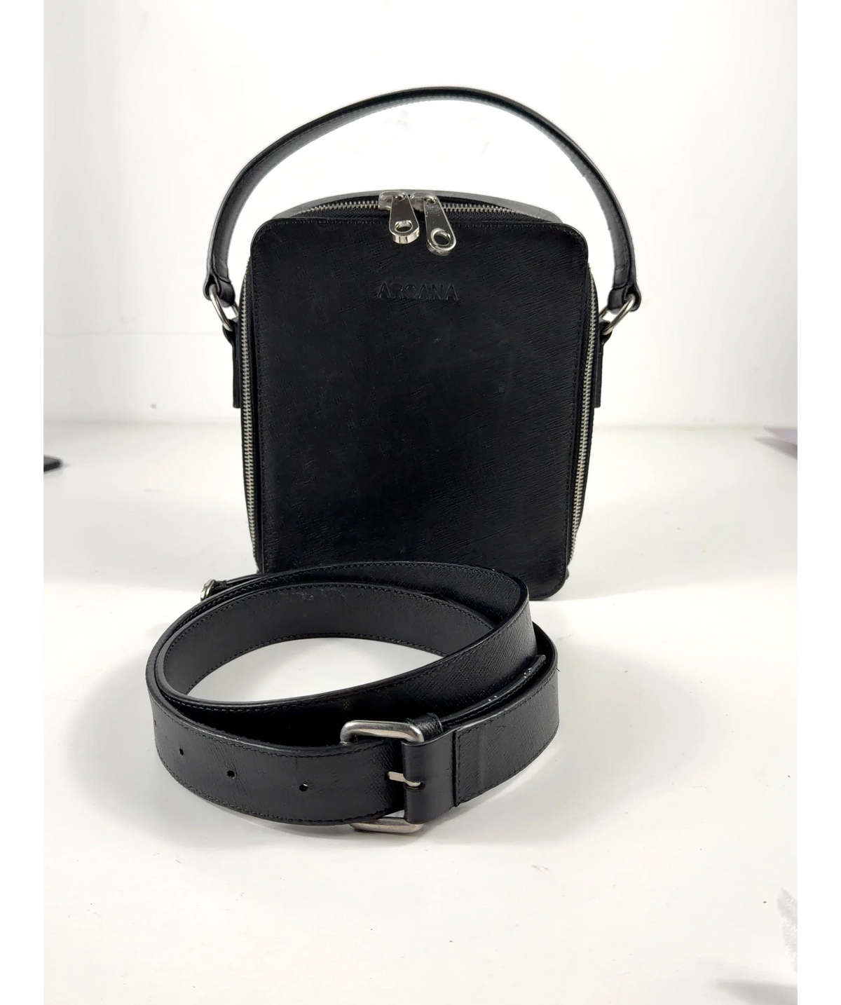 ARCANA Black The Crossbody Bag — care label