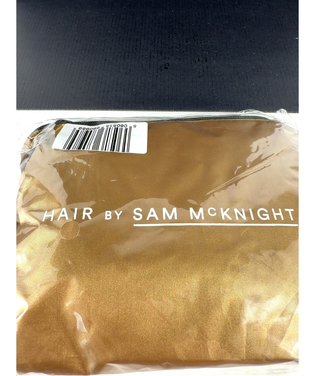 Hair By Sam Mcknight gold makeup bag or pouch — label