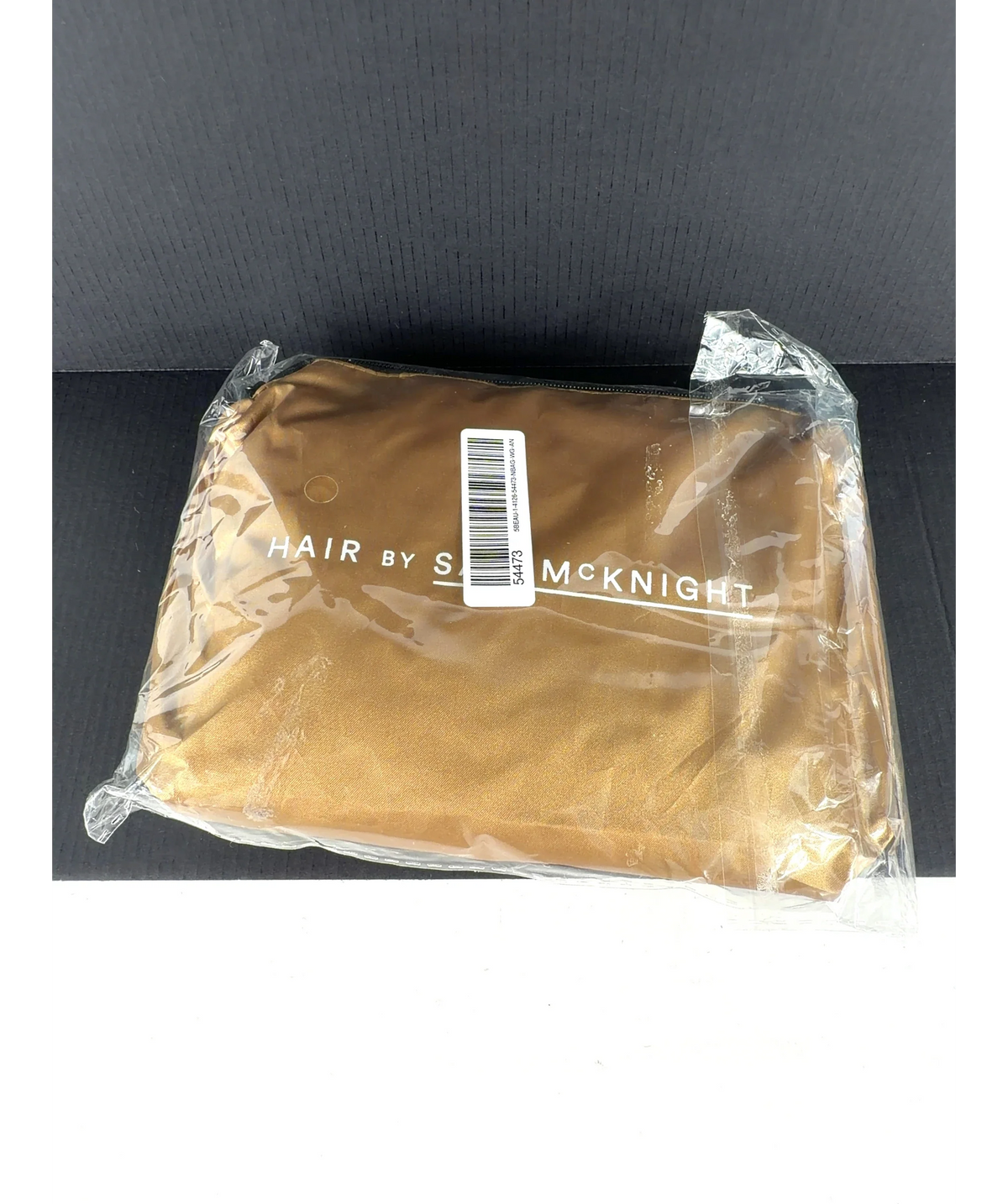 Hair By Sam Mcknight gold makeup bag or pouch — care label
