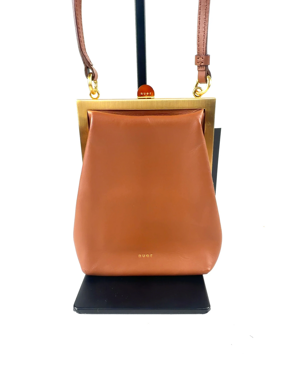 nuer Brown structured trapezoidal frame cross-body bag — care label