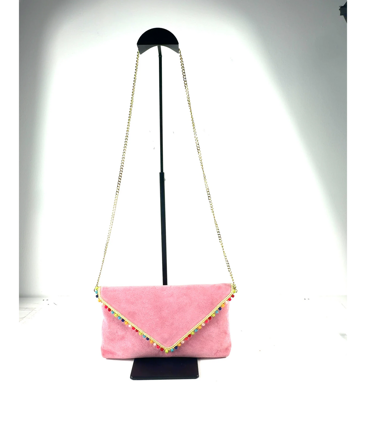 Anthropologie Pink leather/suede envelope clutch with pom-pom trim and a chain strap — care label