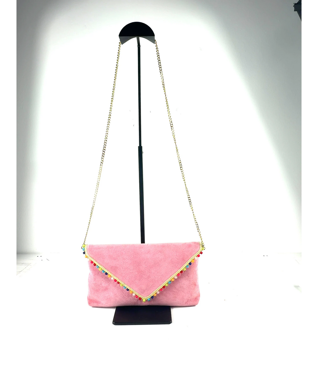 Anthropologie Pink leather/suede envelope clutch with pom-pom trim and a chain strap — fabric detail