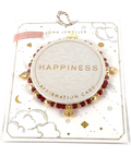 Joma Jewellery Red Affirmation Card 'Happiness' Bracelet in Gold Plating — front