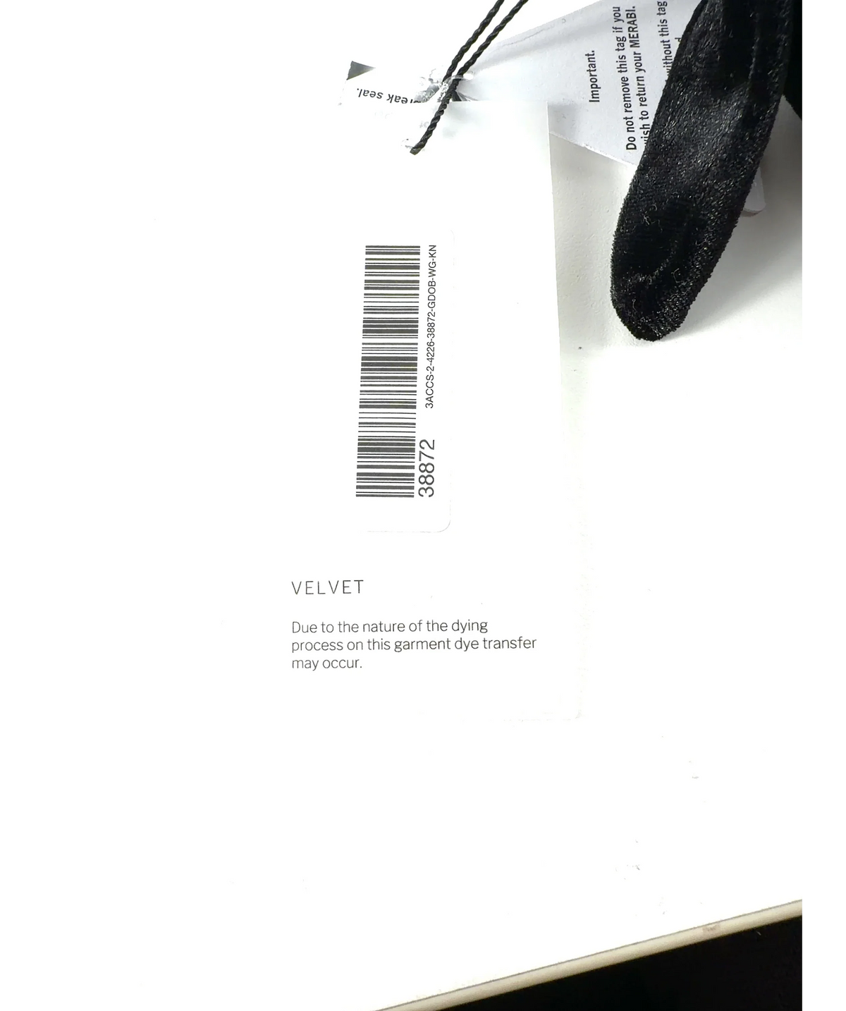 NADINE MERABI Black Colour — care label