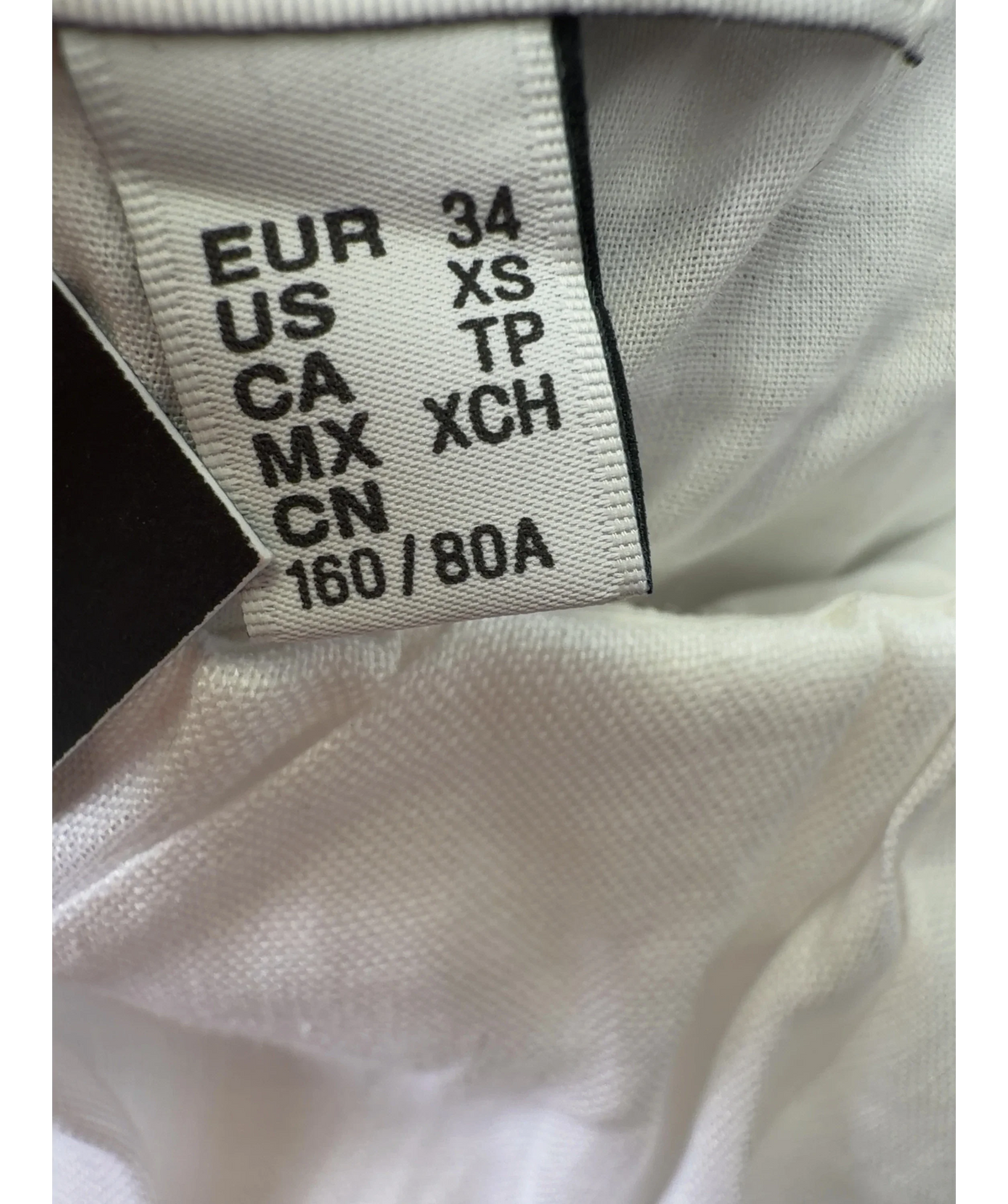 H&M White Colour, size UK XS — care label
