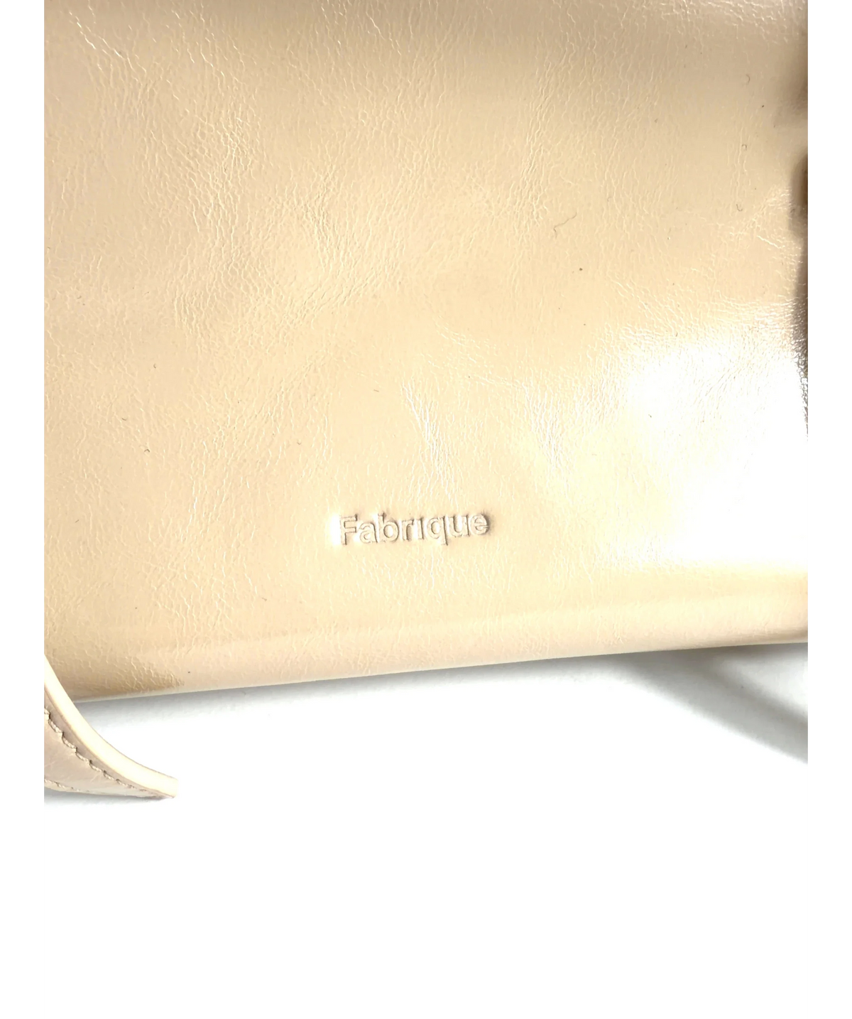 Fabrique Beige East West Shoulder Bag — care label