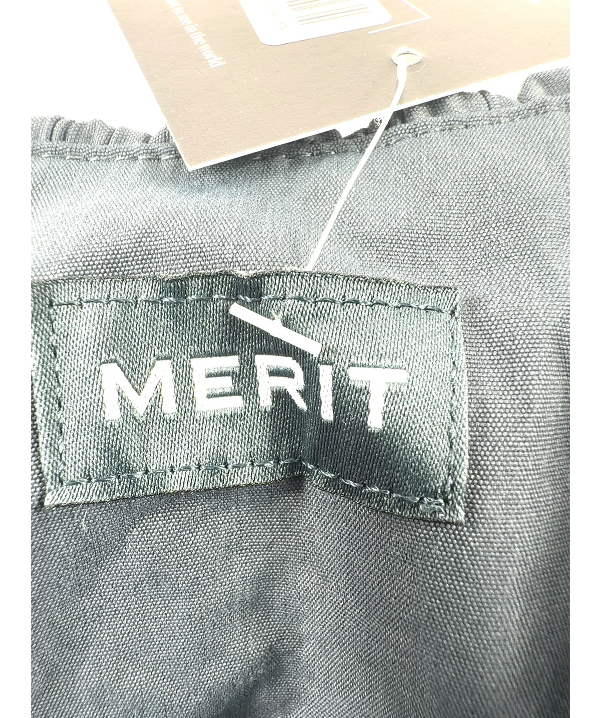 merit Grey Signature Bag — label