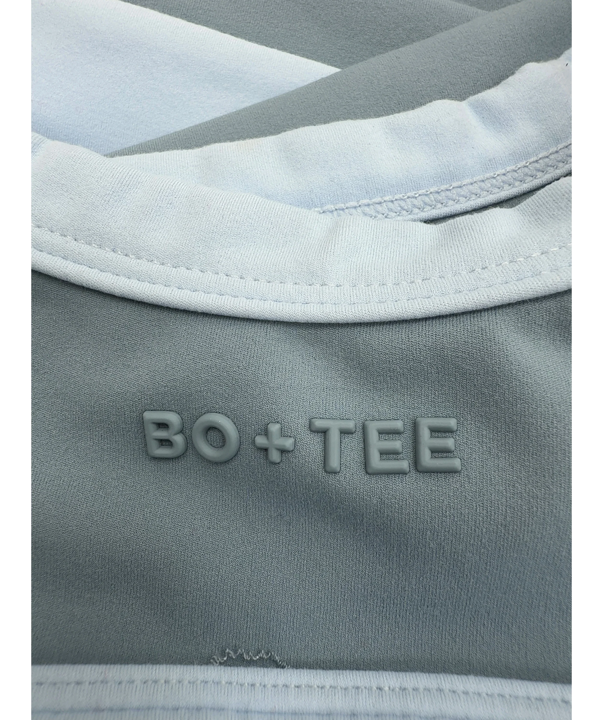 Bo + Tee Blue Soft Active Scoop Neck Sports Bra and Soft Active Pocket V-Waist Mini Shorts, size UK XS/S — fabric detail