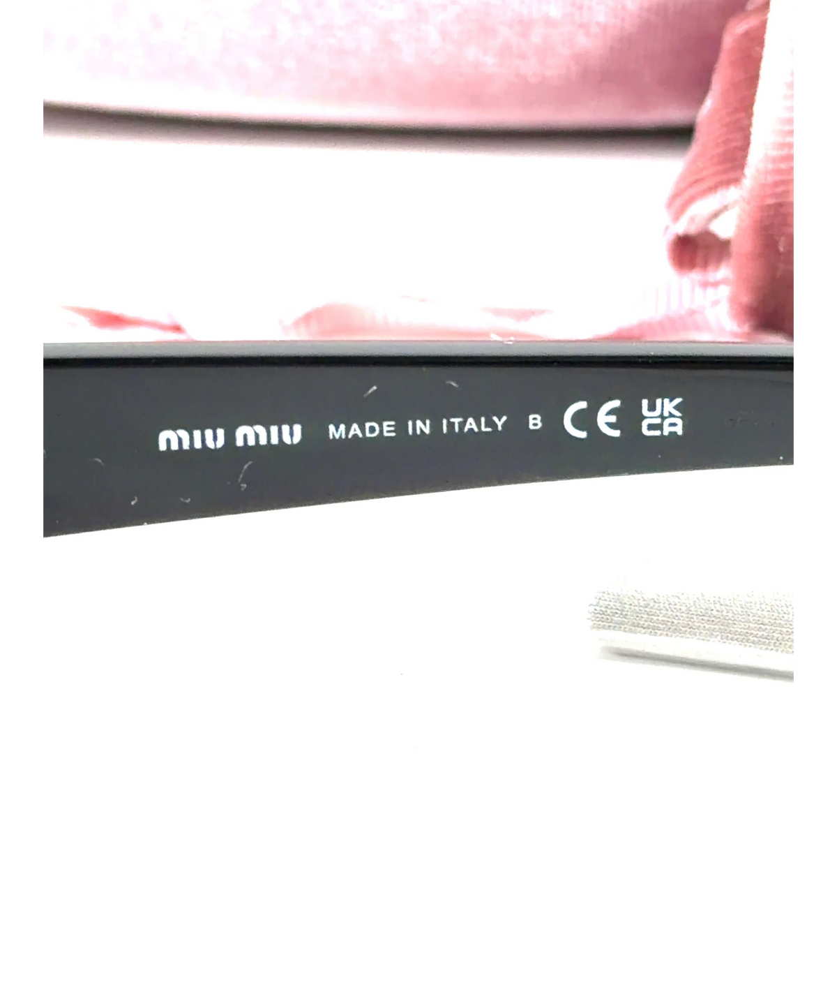 Miu Miu Black MU B13S (SMU B13) sunglasses — care label