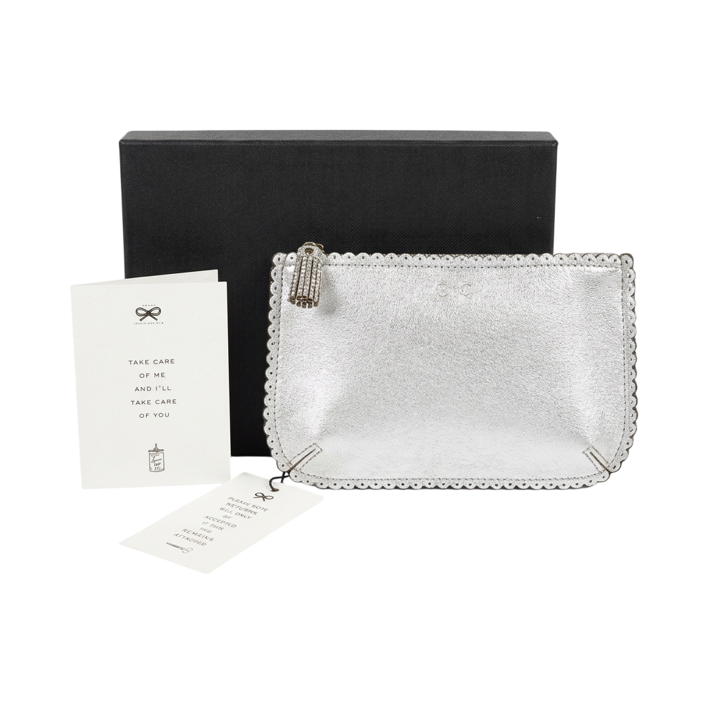 Anya Hindmarch Scalloped Edge Mini Zip Pouch / Clutch in metallic silver leather.