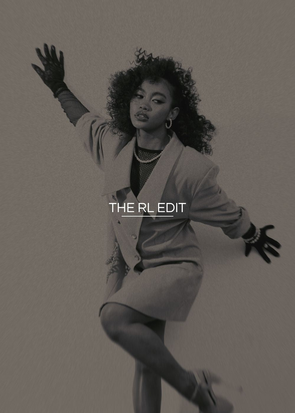 Person in a stylish outfit with 'THE RL EDIT' text on a gray background