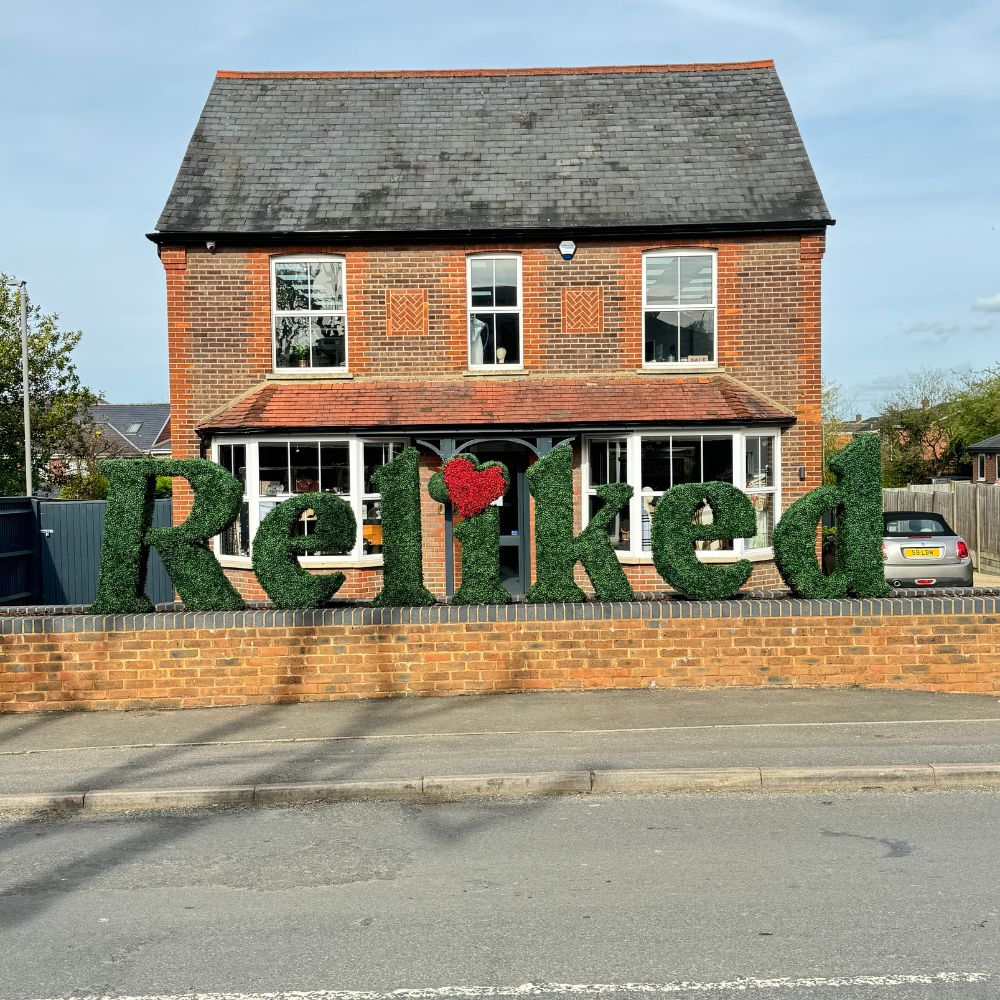 Brick house with 'Reliked' sign in front