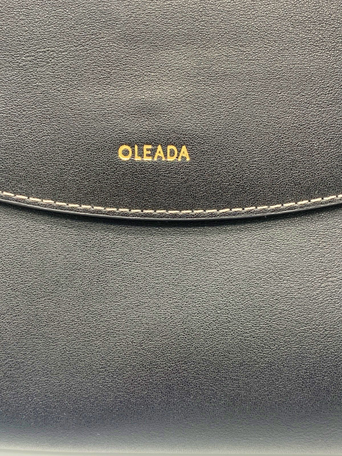 Oleada Black Clutch Bag