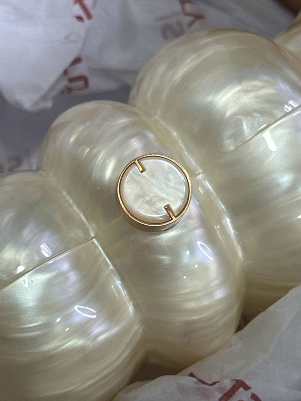 Cult Gaia Ivory Pearlescent Puffer Clutch Bag with chain strap