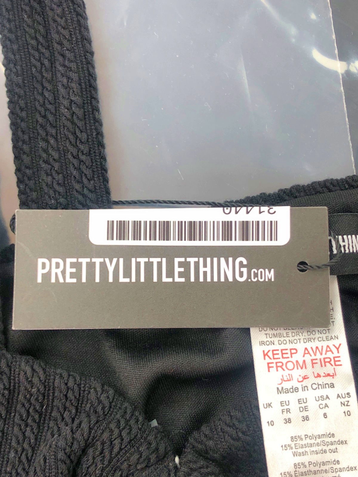 PrettyLittleThing Black Asymmetric Ribbed Top UK 10